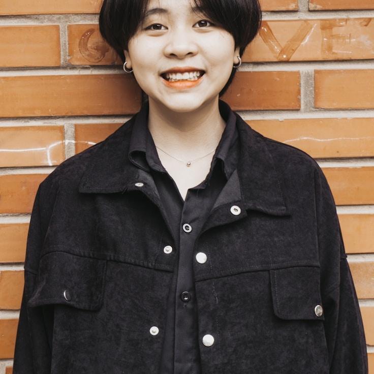 Kaveri Mehta, Lead Design Curator at Field Grove Nook, reviewing corporate floral arrangements